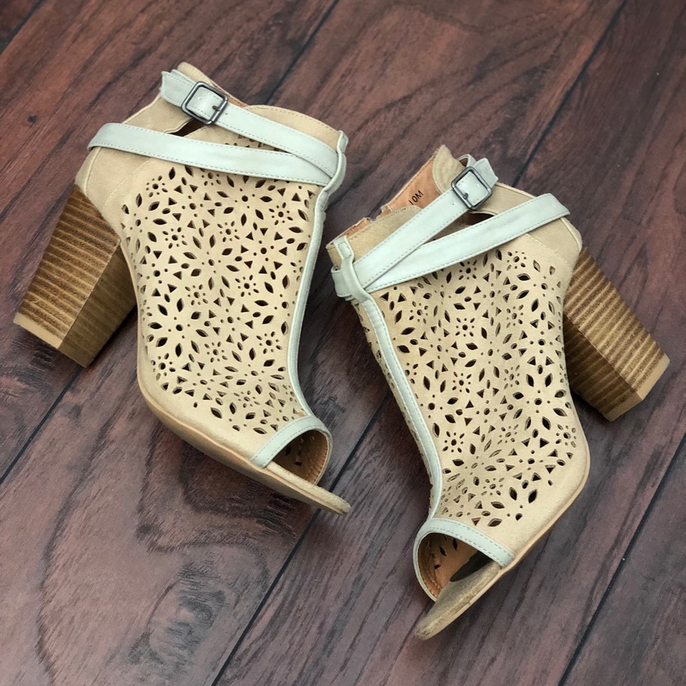 BKE Sole peep toe eyelet cut out heeled booties. Beautiful but too big.